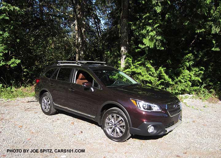 2017 Outback Touring brilliant brown color shines in the sun. Standard rocker panel chrome strip, silver low profile roof rails, silver and gray alloy wheels