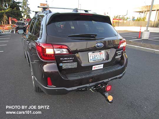 2017 Outback Touring brilliant brown color, with aftermarket 2" trailer hitch with dual 2" receiver and lower hitch ball (tennis ball), with aftermarket brake light for added safety. No one will want to bump into the back of this car in the parking lot.