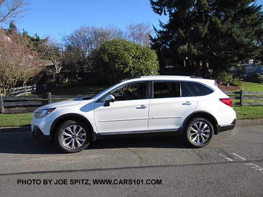 new 2018 Subaru Outback 3.6 Touring, with optional body side moldings, wheel arch moldings etc. Aftermarket 2" trailer hitch with brake light and hitch ball stop people from running into the rear bumper.