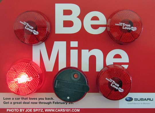 Subaru's 2015 True Love Event mirror hang tag- Be Mine, Love A Car That Loves You Back, with the free clip-on flashing red lights