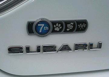 subaru badge of ownership, a 2008 white STI, their 7th car, with pets, theater, rally