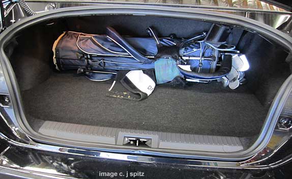 golf clubs in the trunk of a subaru brz