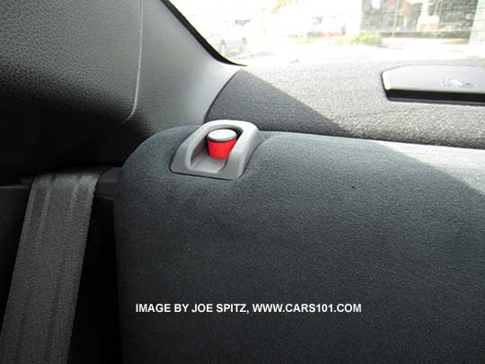 Subaru BRZ rear seat latch alert is in the upper corner of the seat. Shown unlatched with red popup button