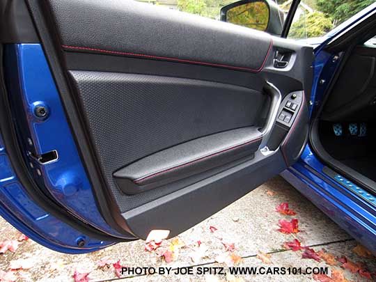 2016 Subaru BRZ Limited drivers door panel, perforated leather trim, red stitching, courtesy lights. WRBlue car shown.