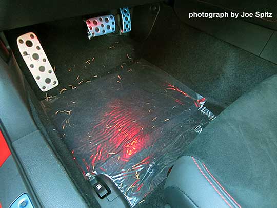 2016 BRZ with optional Footwell Illumination- red color shown. Protective plastic sheet over the carpet reflects the LED light