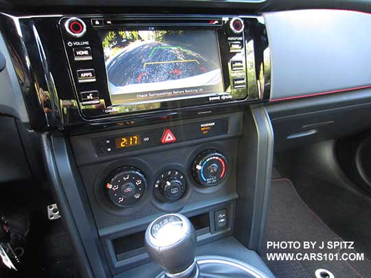 2017 Subaru BRZ Premium gray console side trim, manual heater/ac controls, 6.2" audio displaying the reverse back-up camera
