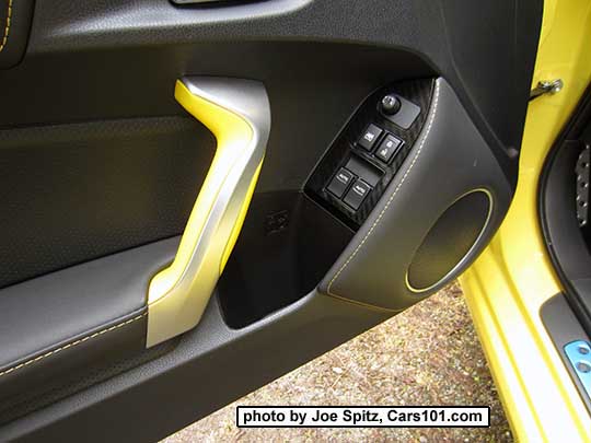 2017 Subaru BRZ Limited Series.Yellow driver's door panel with yellow door grab handle and gloss power window trim over carbon fiber-like under trim