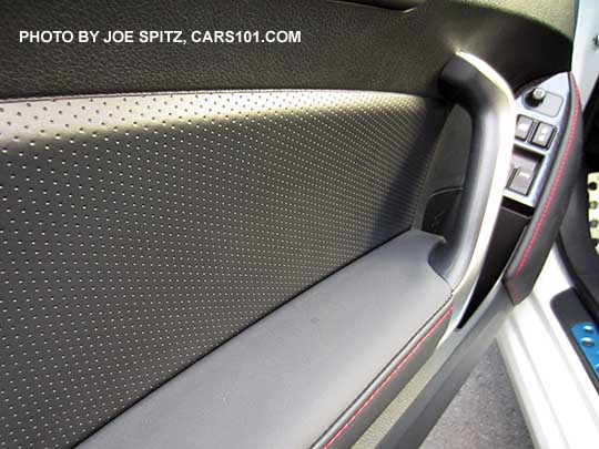 2017 Subaru BRZ Limited driver's door panel- perforated leatherette door insert and leatherette armrest, red stitching, , silver door grip, illuminated power window and door lock switches.