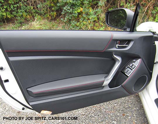 2017 Subaru BRZ Limited driver's door panel with silver grab handle and door courtesy lights