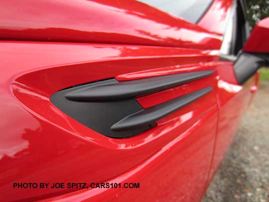 2017 Subaru BRZ front fender black trim on a pure red car