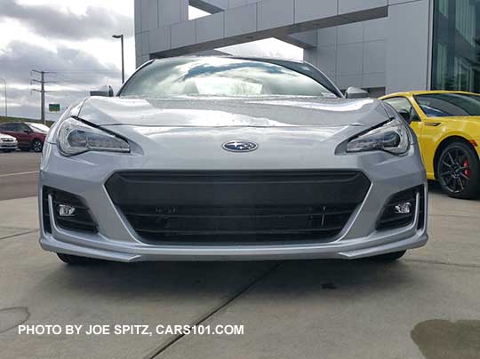 front view 2017 ice silver BRZ Limited with fog lights.  Charlesite yellow BRZ Limited series.yellow in the background