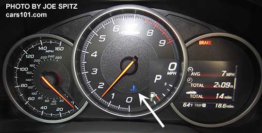 2017 Subaru BRZ Limited dashboard performance gauges. White arrow points at the blue cold engine information light that comes on to let you know the engine is cold.