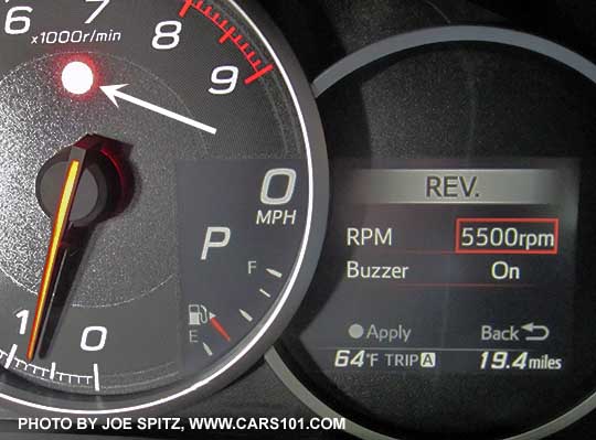 2017 Subaru BRZ Limited dashboard digital performance gauge on Rev alarm/buzzer settings screen. White arrow points at the warning light