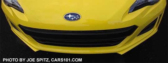 2017 Subaru BRZ front  bumper Pleiades star cluster logo, shown on a Charlesite Yellow car