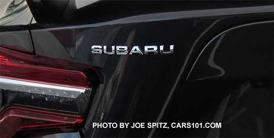 2017 BRZ Subaru left rear silver badge on a dark gray car