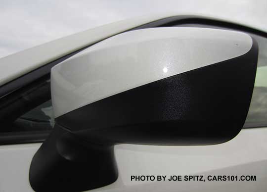 closeup of the 2017 Subaru BRZ outside mirror body colored upper and matte black lower side mirror. Crystal white shown.