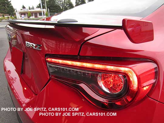 closeup of the 2017 BRZ black rear spoiler with body colored tips and supports. Pure red shown