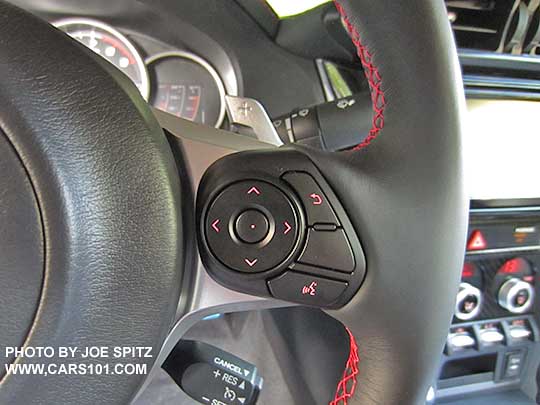 2017 Subaru BRZ Limited leather wrapped steering wheel, red stitching with right side fingertip performance gauge controls, and separate cruise control button. Automatic model shown with paddle shifters
