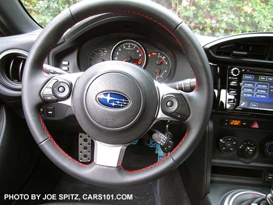 2017 Subaru BRZ Premium steering wheel, gray leather wrapped, red stitching, left side fingertip audio and bluetooth controls, right side 'talk' button...