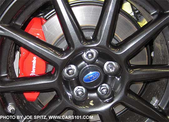 closeup of the 2017 Subaru BRZ  17" 10 spoke black alloy rear wheel. Red Brembo dual piston caliper rear brakes are on Limited with optional Performance Pkg and on all Series.Yellow. Rear wheel shown.