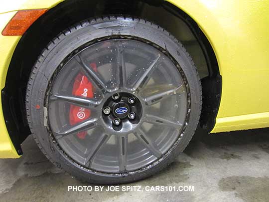 2017 BRZ Limited Series.Yellow black alloy wheel with protective shipping plastic still covering it.