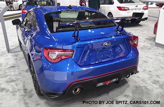 rear view 2018 Subaru BRZ tS with adjustable STI carbon fiber rear spoiler, red rear bumper trim stripe. rear corner underspoilers, WR Blue color shown. Seen at the 2017 Seattle Auto Show.