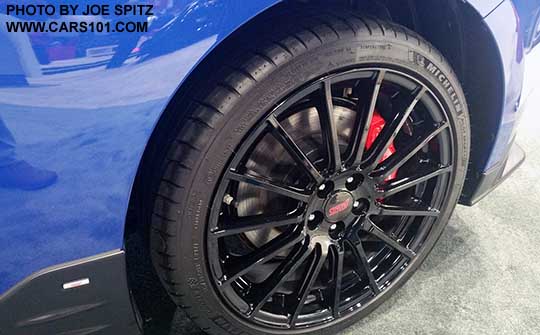 2018 Subaru BRZ tS black STI 18x7.5" alloy wheel with Michelin Pilot summer tire, red Brembo calipers, black STI rocker panel trim.
