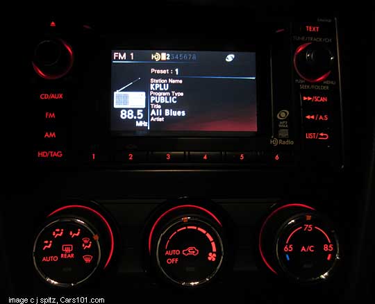 Subaru crosstrek limited stereo and heater controls shown at night, red lit