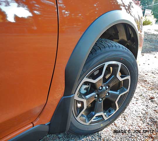 close-up of subaru crosstrek wheel arch moldings with optional splash guard