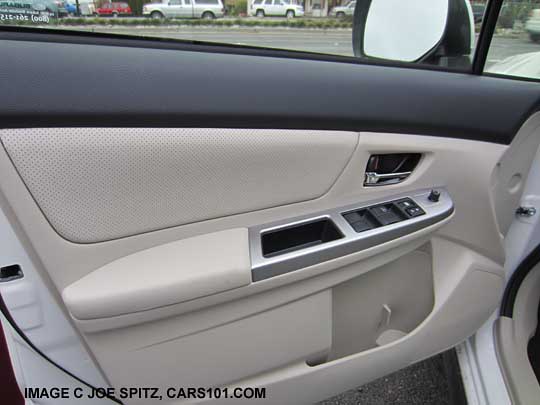 2014 Subaru Crosstrek Hybrid driver door panel with silver trim, ivory shown