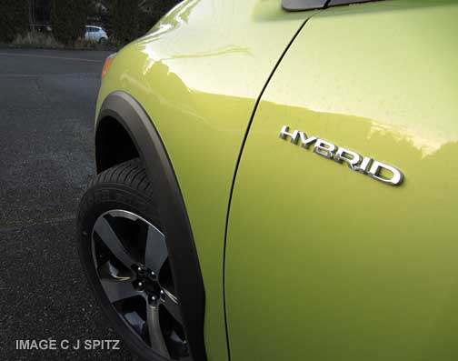 2014 subaru crosstrek hybrid logo. plasma green color shown