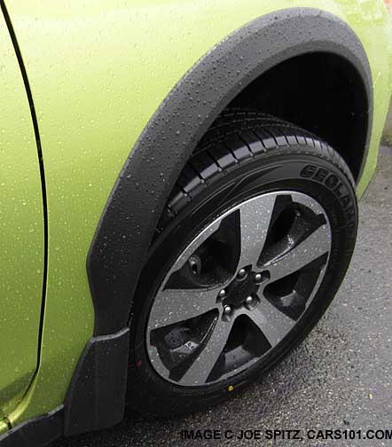 Crosstrek wheel arch molding, Hybrid model shown, plasma green, in the rain