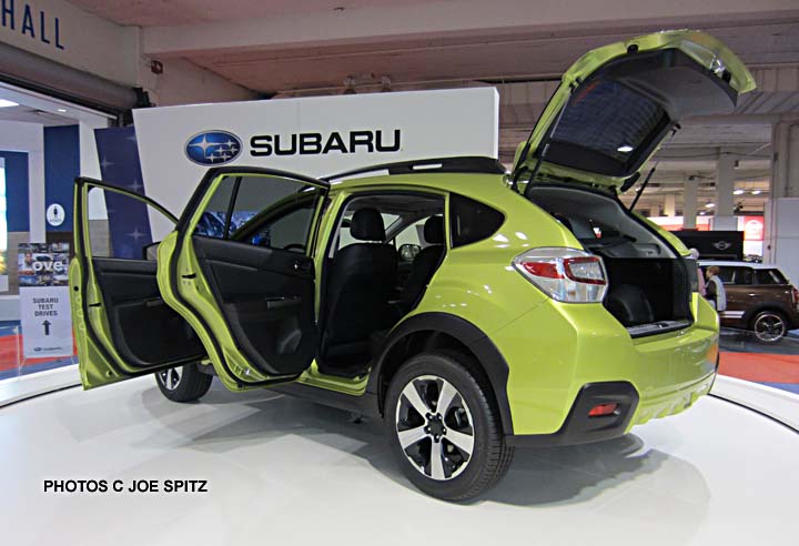 doors open on the plasma green subaru xv crosstrek hybrod, 2013 seattle auto show, october