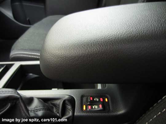 2015 Crosstrek console with all weather package heated seat buttons, and armrest slid forward