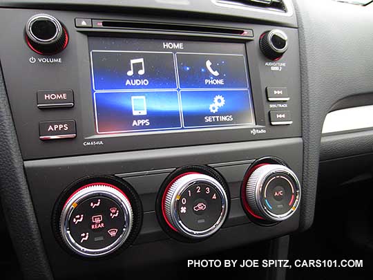 2015 Crosstrek 2.0i base model audio- 6.2" LCD, matte gray surround, physical buttons. Heater/ac silver knobs, red lit
