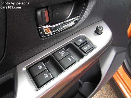 close-up of the 2015 Crosstrek front door power window buttons, driver's door shown