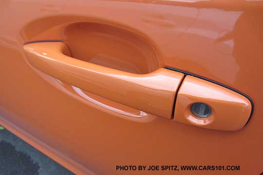2015 Crosstrek front drivers door handle, body colored, tangerine orange shown
