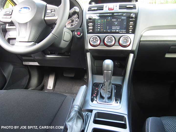 Interior photo of the 2015 Crosstrek Premium Special Edition with black cloth, gloss black shift surround, pushbutton start, upgraded 7" audio, power moonroof