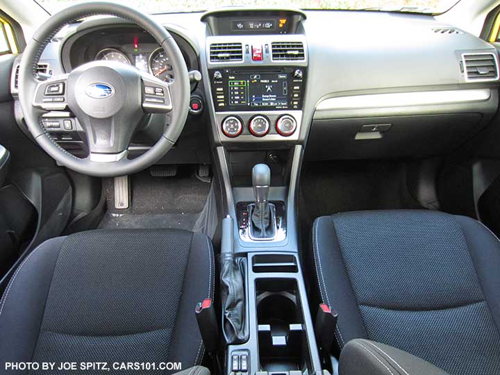 Interior of the 2015 Crosstrek Premium Special Edition with black cloth, gloss black shift surround, pushbutton start/keyless access, power moonroof, leather wrapped steering wheel etc