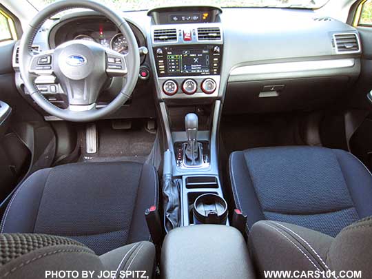 2015 Crosstrek Special Edition interior photo of the black cloth, pushbutton start, glass black CVT shift surround, leather wrapped steering wheel and shift knob...