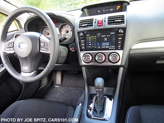 2015 Crosstrek Premium Special Edition interior photo of the black cloth, pushbutton start, glass black CVT shift surround, leather wrapped steering wheel and shift knob, 7" upgraded audio, power moonroof