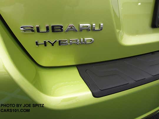 2015 Plasma Green Subaru Hybrid rear logo with rear bumper cover