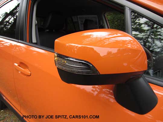 2015 Crosstrek outside mirror with integrated turn signal, on Limited models, Hybrid models, and Premium with optional Eyesight system. Tangerine orange shown