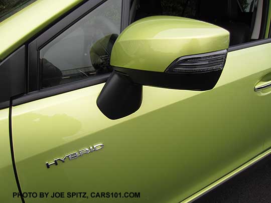 2015 Crosstrek outside mirror with integrated turn signal, on Limited models, Hybrid models, and Premium with optional Eyesight system. Plasma Green Hybrid shown
