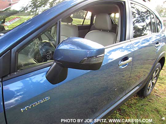 2015 Crosstrek outside mirror with integrated turn signal, on Limited models, Hybrid models, and Premium with optional Eyesight system. Quartz Blue Hybrid shown