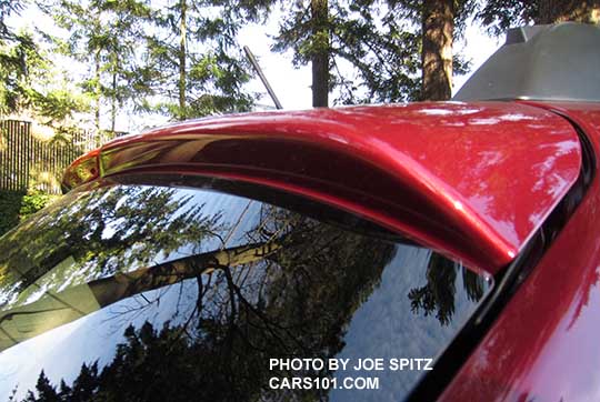 2015 Crosstrek 2.0i, Premium and Limited standard body colored rear spoiler. Venetian Red shown.