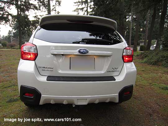 2015 Crosstrek rear view, crystal white, optioanl rear spoiler 15 crosstrek- optional rear spoiler, rear bumper cover, side moldings. Crystal white