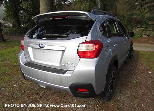 2015 Subaru XV Crosstrek rear view, with optional rear bumper cover step pad, ice silver shown