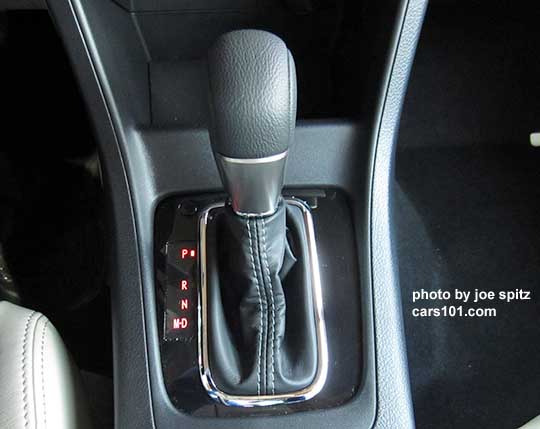 close-up of a 2015 Subaru Crosstrek CVT Limited leather wrapped shift knob, with gloss black surround