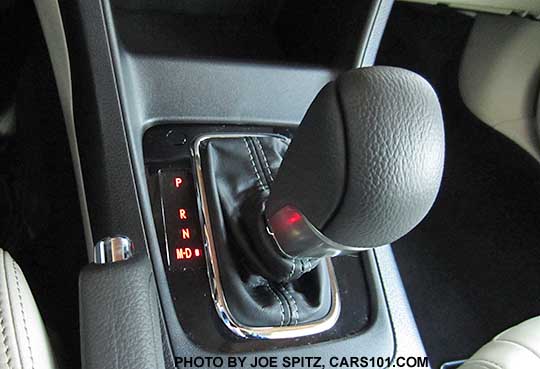 close-up of a 2015 Subaru Crosstrek CVT leather shift knob, with gloss black surround